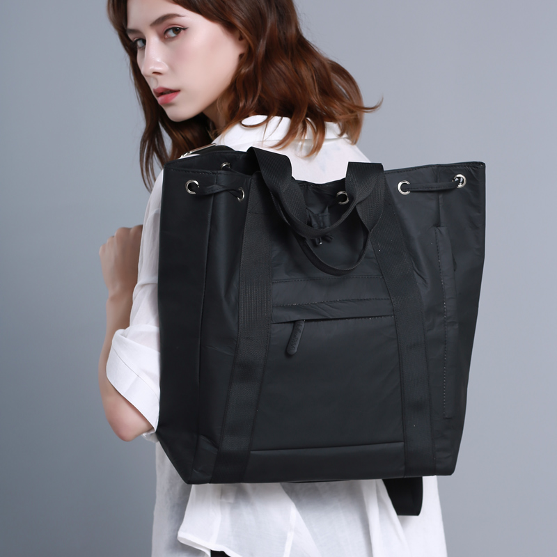 حقيبة ظهر Tyvek سوداء متعددة الاستخدامات للنساء: قابلة للتحويل وخفيفة الوزن وأنيقة - مثالية للعمل والكلية